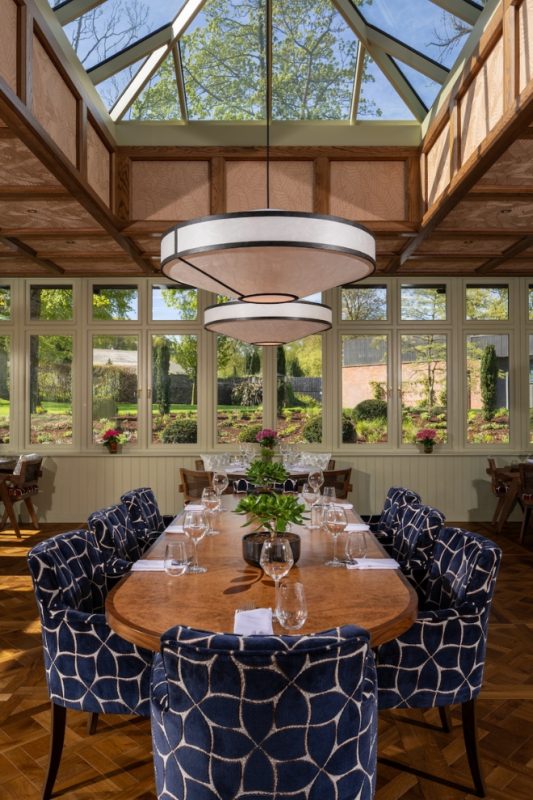 Guests dining in the Garden Room at Coq & Bull
