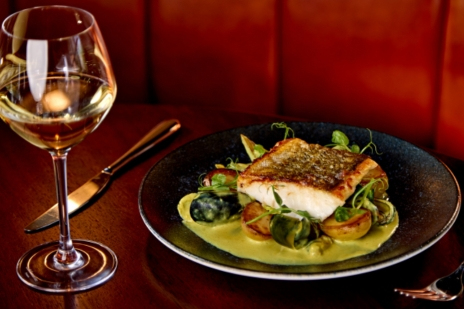 Pan-seared local fish served with seasonal vegetables and white wine at Coq & Bull brasserie, Clandeboye Lodge