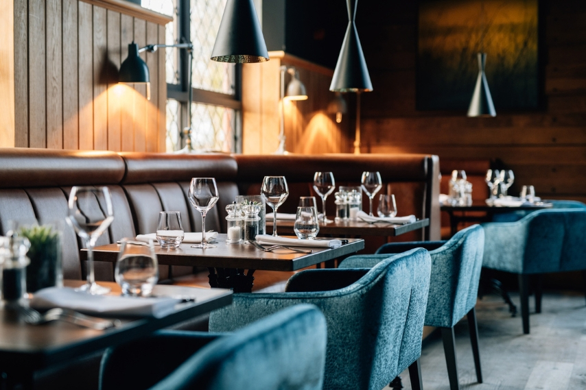 Tables set for lunch and dinner in the Coq & Bull Brasserie