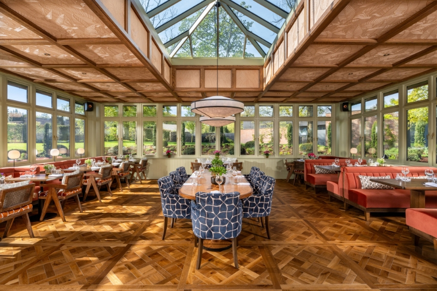 Light-filled Garden Room dining space at Coq & Bull