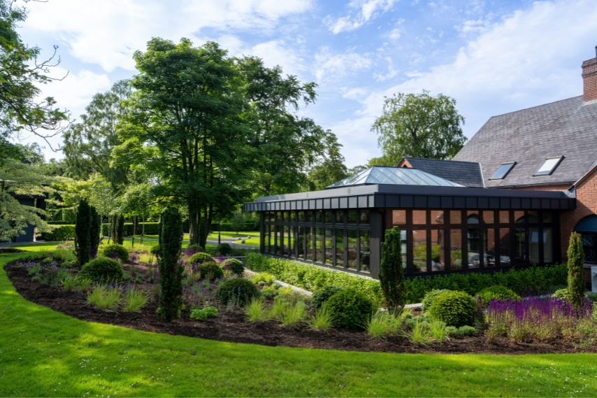 Garden Room exterior overlooking the gardens at Coq & Bull near Bangor
