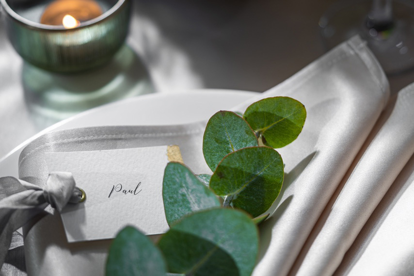 Eucalyptus and place card detail on a table at our wedding venue in Northern Ireland.