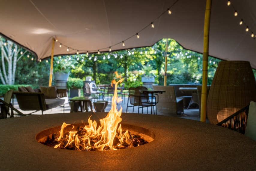 Outdoor fire pit with festoon lighting at a formal venue in Northern Ireland